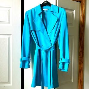 Sharp jacket. Snaps across the waist for a clean look and belt for added detail